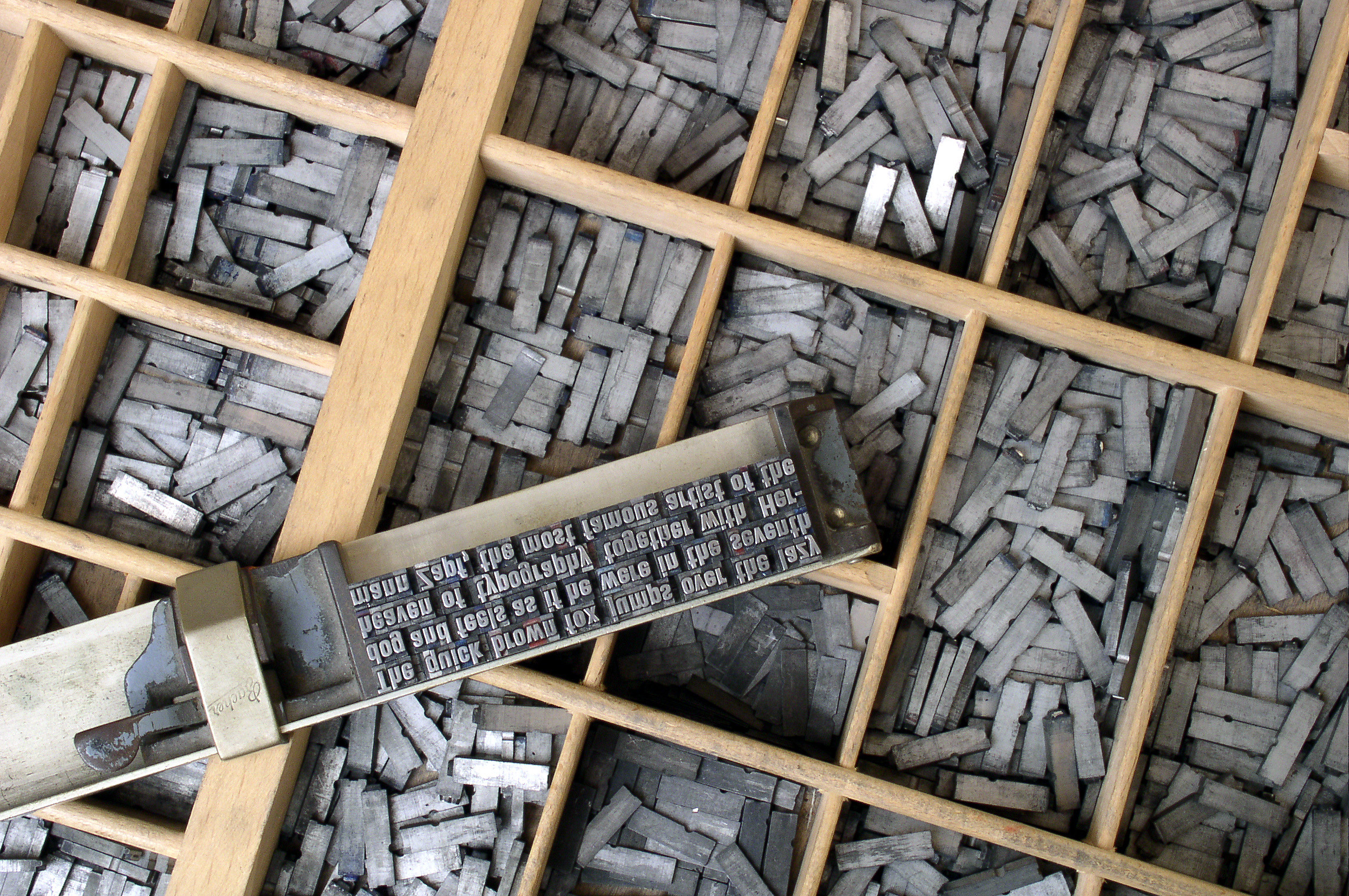 Metal types in letter cases and a composing stickWilli Heidelbach from Wikipedia, CC BY 2.5